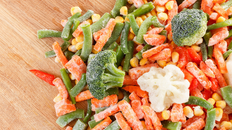 frozen veggies on wooden board