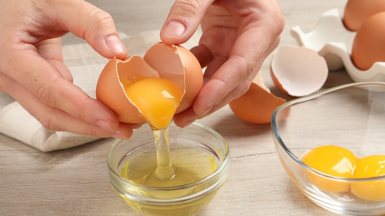 Cracking eggs in a bowl