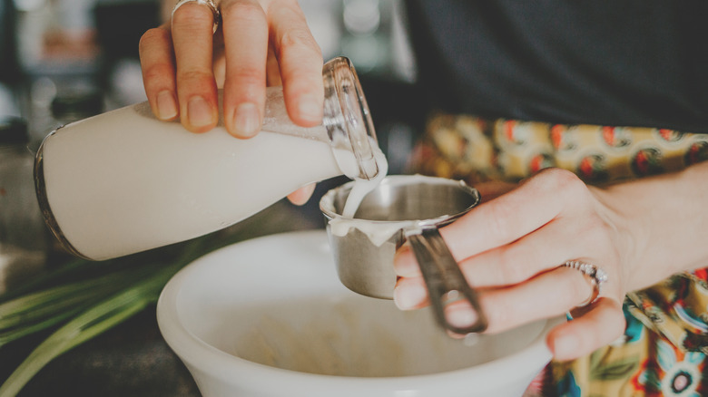 Person making ranch dressing