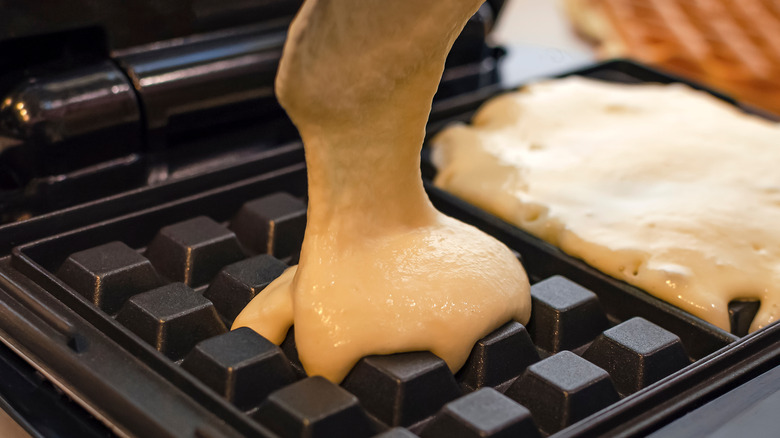 Batter poured onto waffle iron