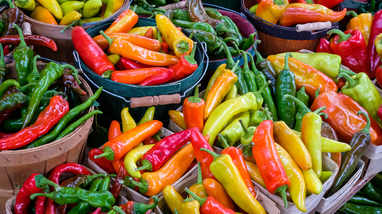 Assorted chili peppers in baskets