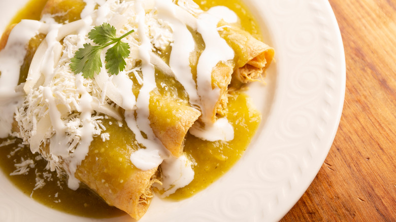 Sour cream on enchiladas