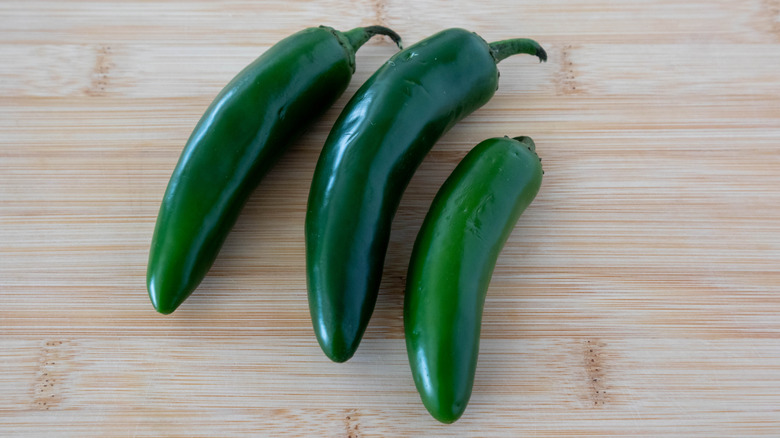 Three jalapeños on counter