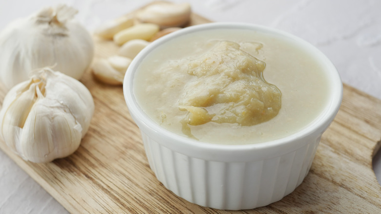 Container of garlic paste