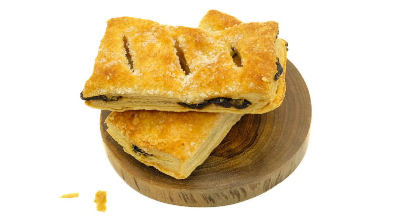 Mince pie puff pastry slice on wooden round