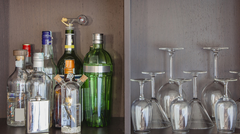 Bottles and glasses in liquor cabinet