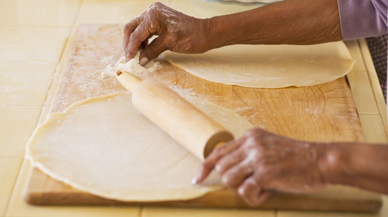 Hands rolling pastry