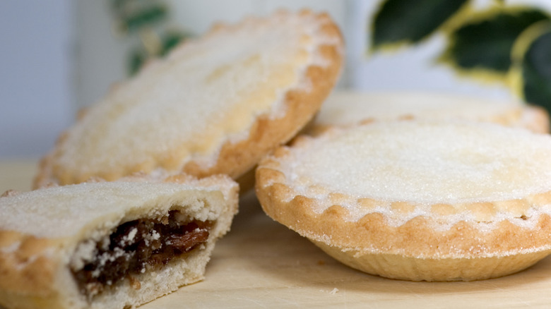 Mince pies on wooden board