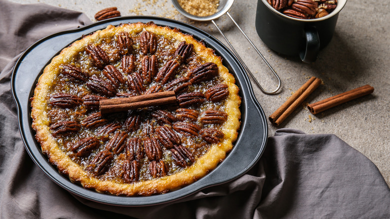 Pecan pie in pie pan with spices