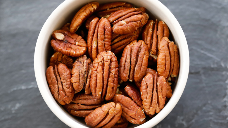 White bowl of pecans