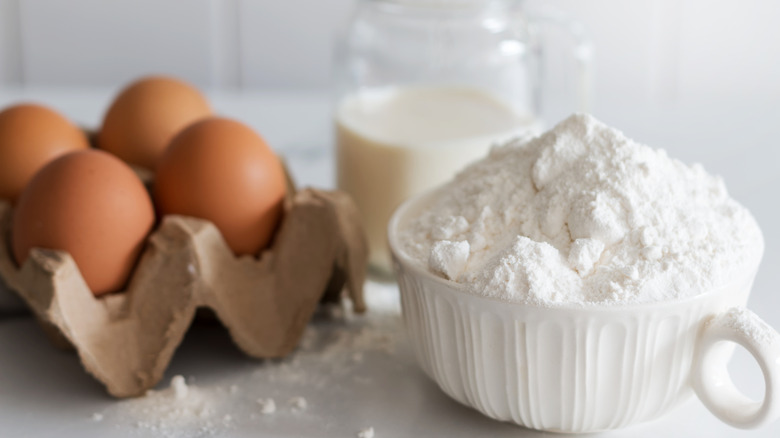 Eggs, milk, and flour on counter