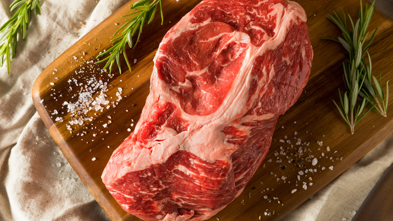 raw pot roast on a cutting board