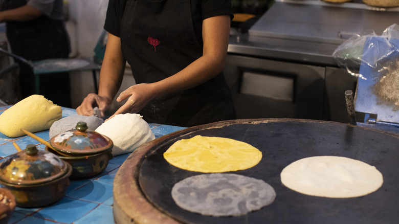 various tortillas on griddle