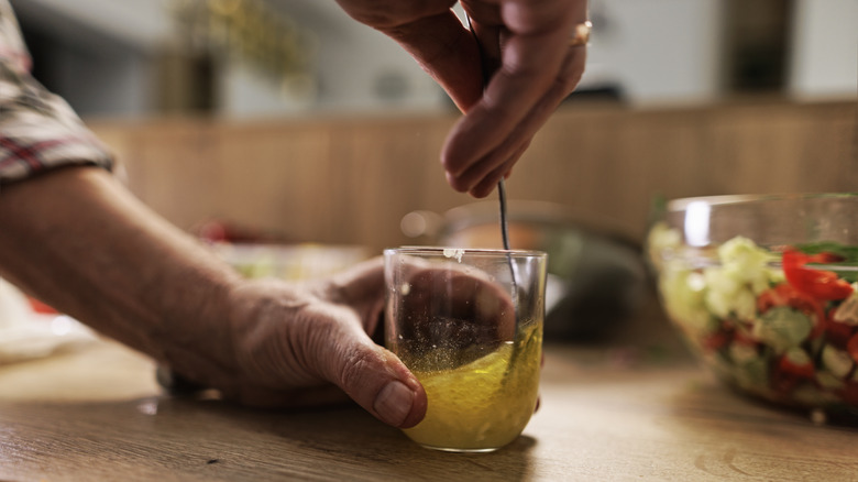 Person making vinaigrette