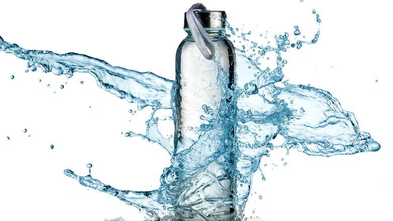 Water splashing out of bottle