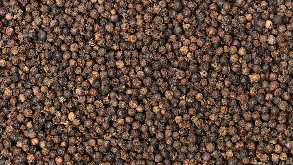 Whole black peppercorns