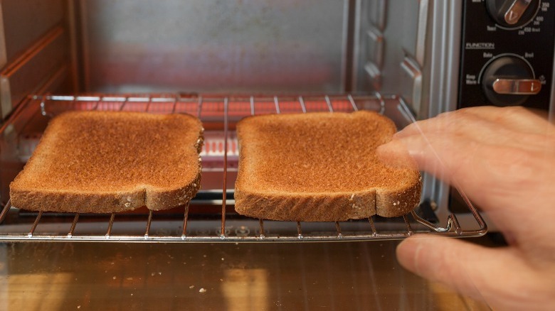 hand reaching for toast