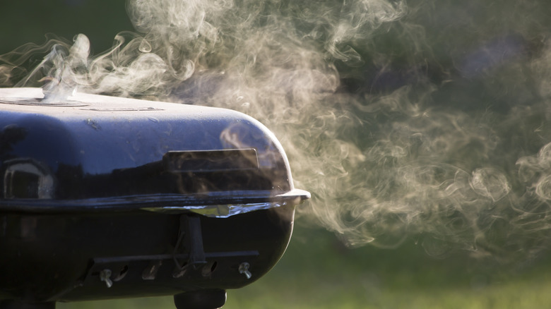 Black barbecue with lid on