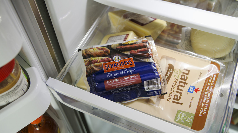 pack of hot dogs in a freezer 