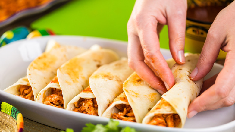 rolled enchiladas in baking dish