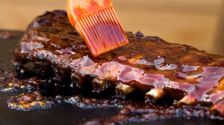 Brush basting rack of ribs