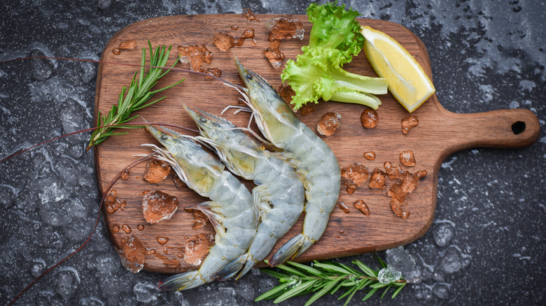 frozen shrimp on wooden board