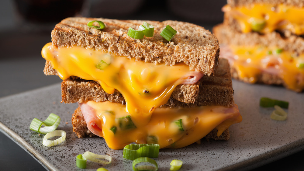 Grilled cheese sandwich with wheat bread and oozing cheese 