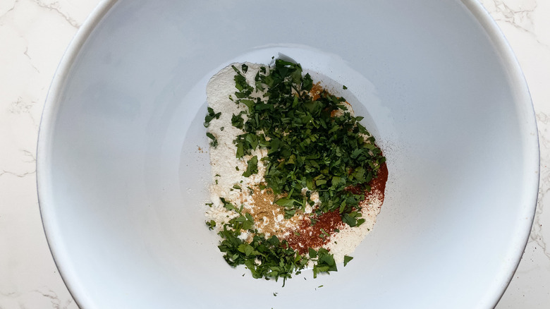 The dry ingredients and cilantro in a bowl