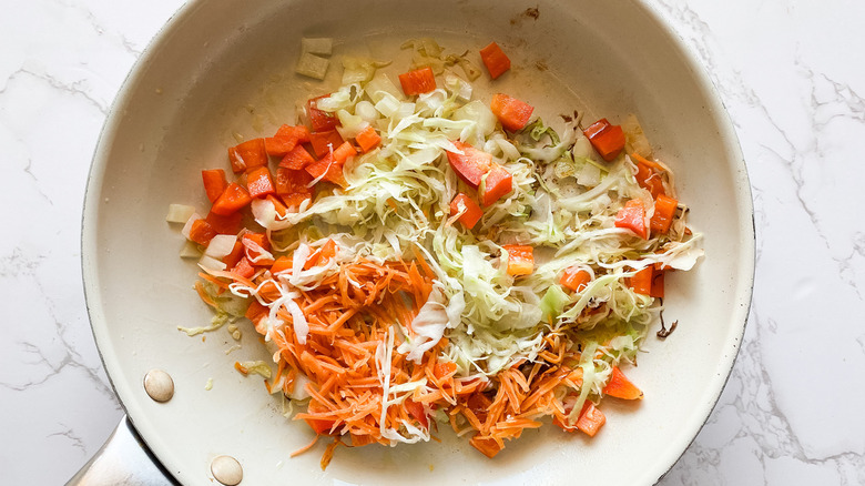 Vegetables about to be sauteed in a skillet