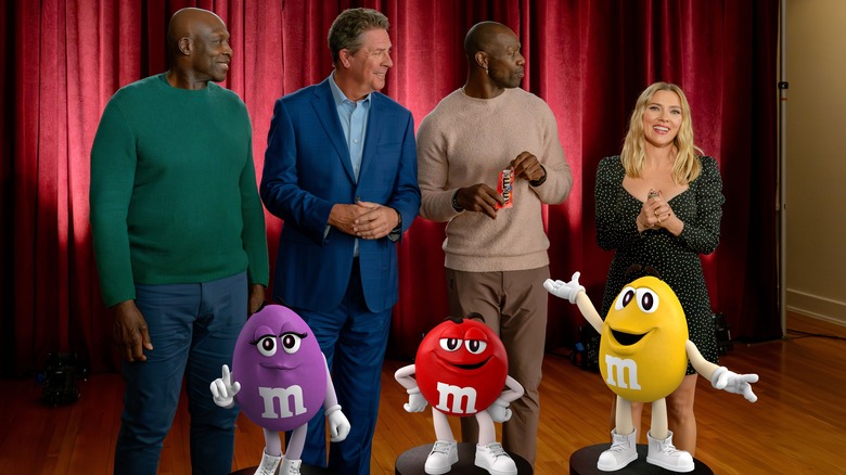 Football players and Scarlet Johansson with M&M's figures