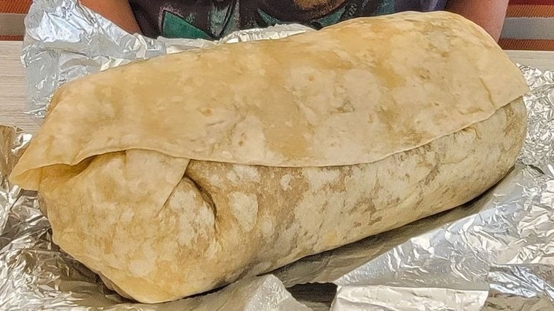 Moe's burrito atop foil
