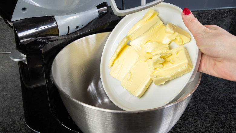 butter on plate into mixer