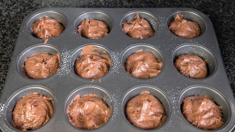 batter in a cupcake tray