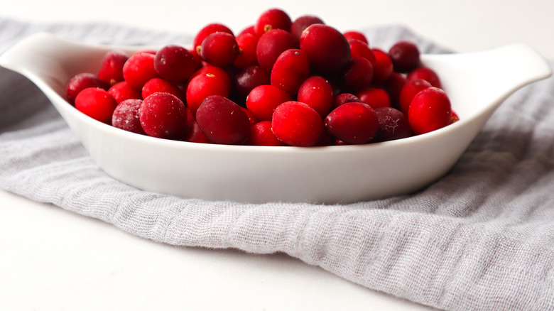 frozen cranberries in white dish