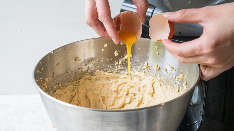 egg cracked over bowl