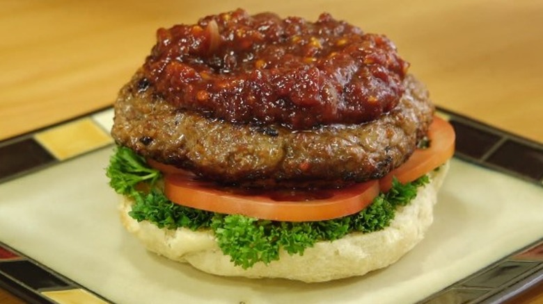 A burger topped with monkey gland sauce