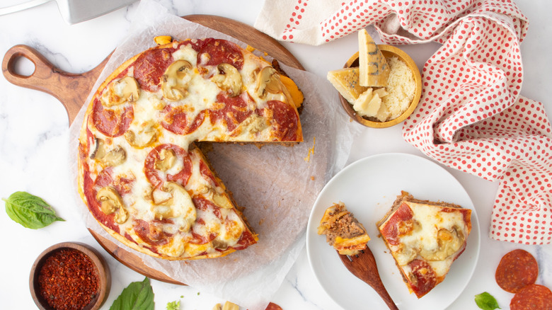 mushroom pepperoni burger pizza sliced