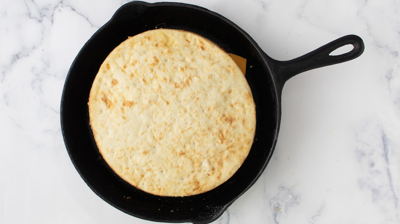 pizza crust in skillet