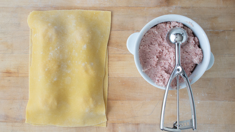 mortadella ravioli being filled