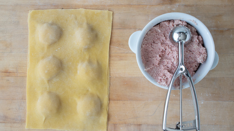 mortadella ravioli being filled