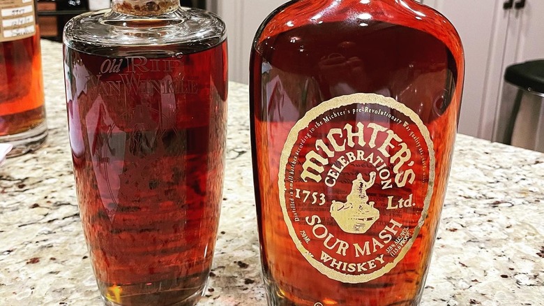 Michter's Celebration Sour Mash next to Old Rip Van Winkle