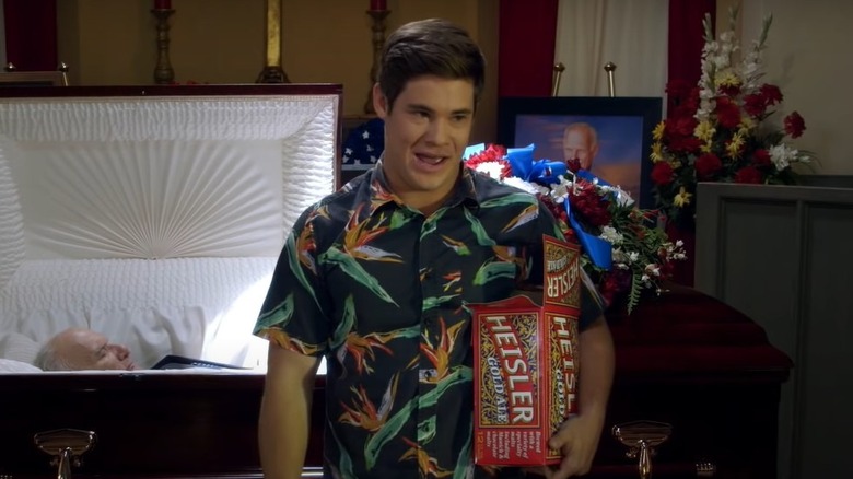 Adam holding case of Heinsler in Workaholics