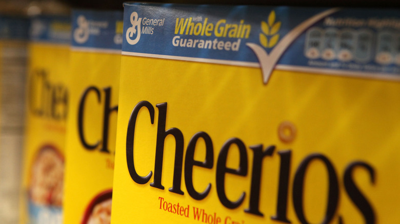 closeup of yellow boxes of Cheerios