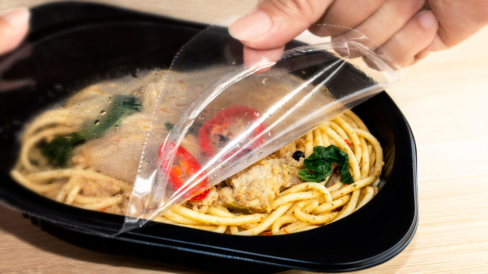 peeling plastic off of microwave meal