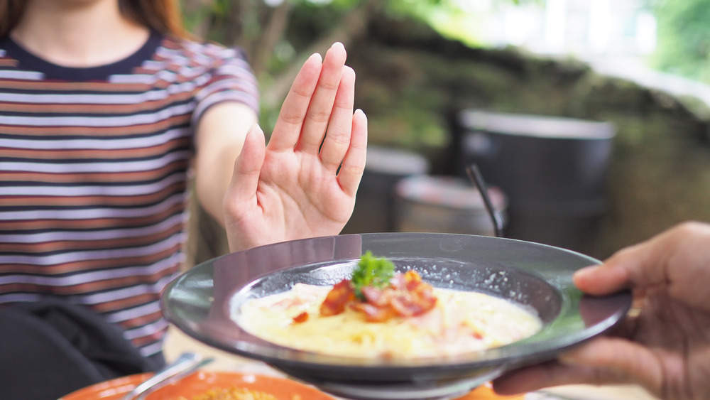 Woman saying no to pasta