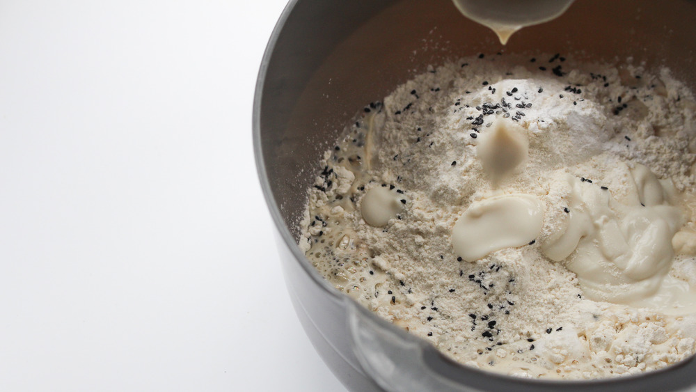 mixing ingredients for naan recipe