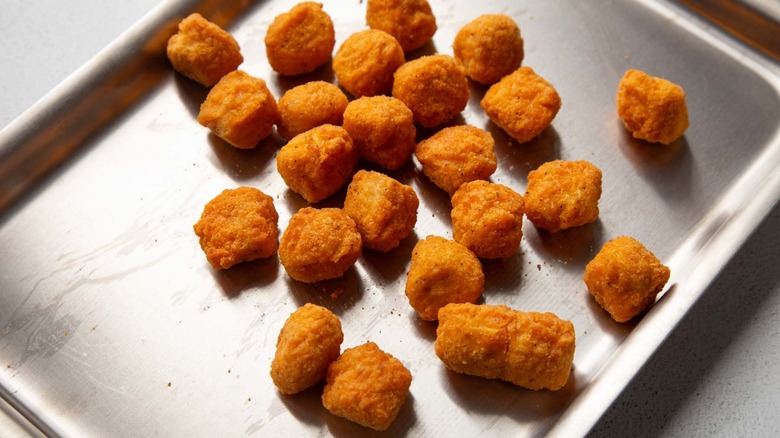 popcorn chicken on baking sheet