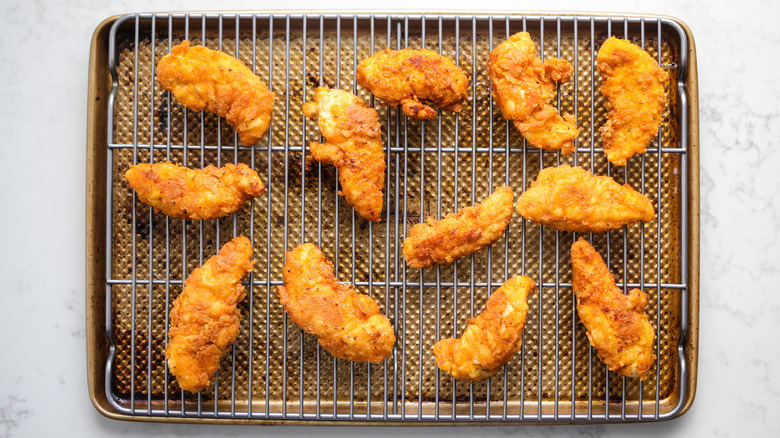 fried chicken tenders in pan