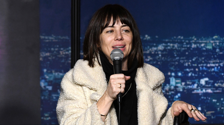 Natasha Leggero in a white coat