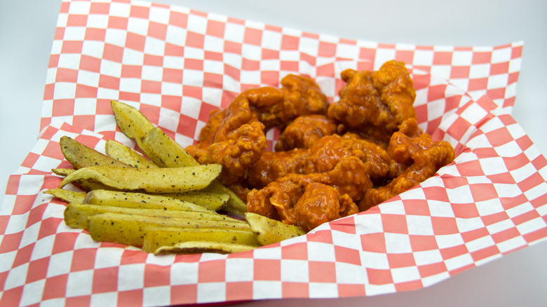 buffalo wings on a red and white napking